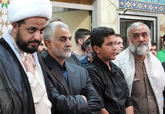 عکس: حاج قاسم و احمدی نژاد در یک مراسم